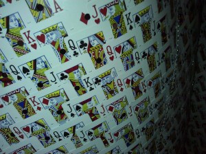 A cape made from recycled casino cards; once a card is creased or torn, the entire deck is thrown away. Photo credit: Louisa Gaylord