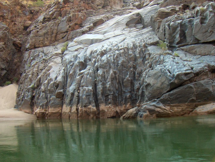 Changing water levels of the Colorado River are easily visible.
