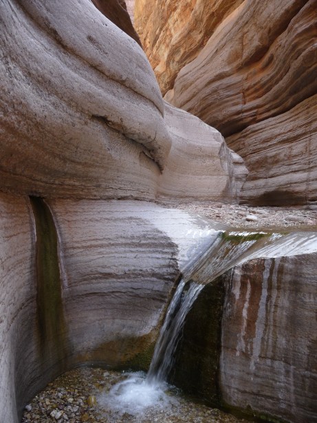 Millions of years of flowing water have carved away at these rocks until they form a smooth channel.