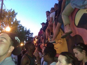 Many of Macklemore's music videos prominently feature Seattle people and locations. Hundreds of fans wait for his arrival at Dick's Drive-In on Capitol Hill for the White Walls video.